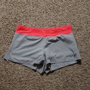 Gray shorts with neon pink waste.